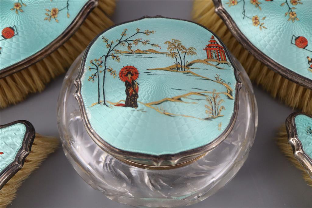 A 1920s silver and gilded chinoiserie guilloche enamel eight piece dressing table set, by Adie Bros,